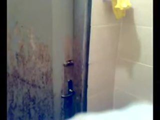 Pakistani young female showering on home mov alone